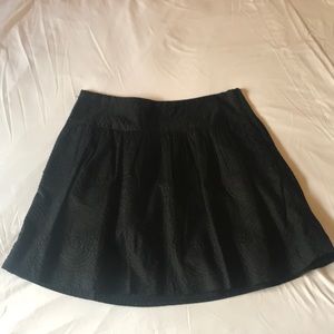 Black skirt with circle pattern.